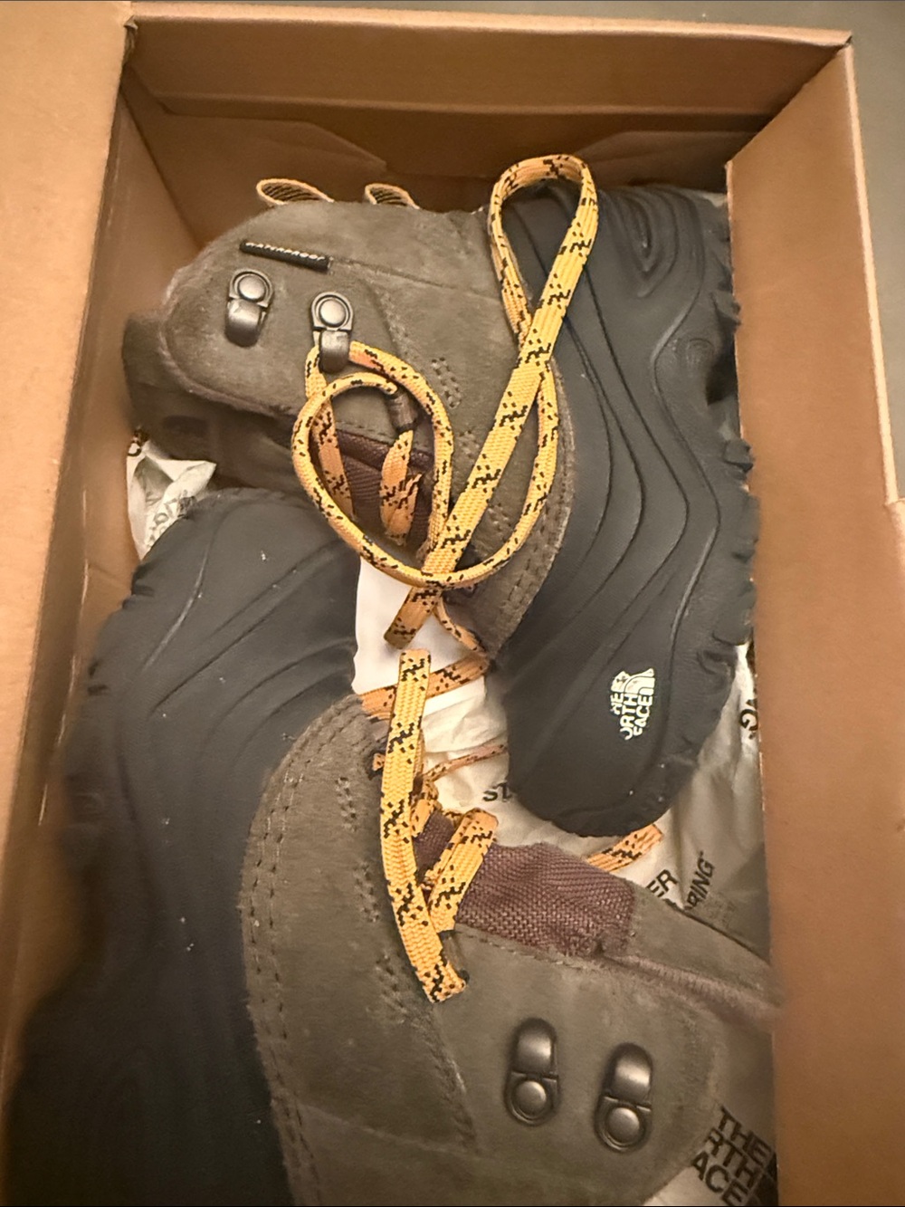 The North Face Men's Brown and Black Trail Boots with Yellow Laces